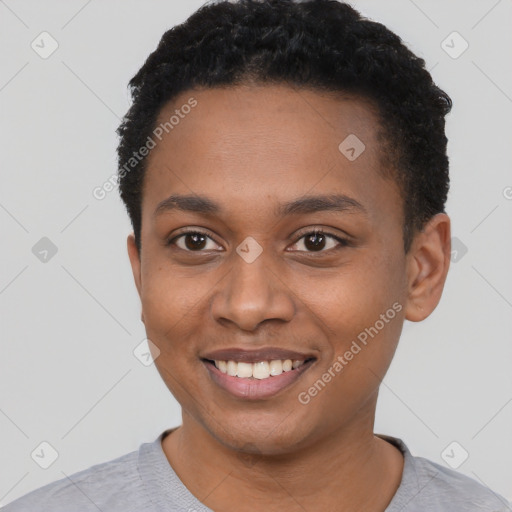 Joyful black young-adult male with short  black hair and brown eyes