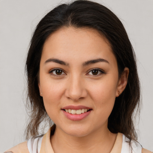 Joyful white young-adult female with medium  brown hair and brown eyes