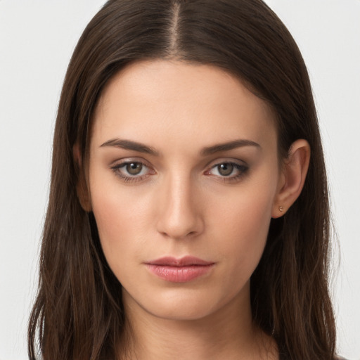 Neutral white young-adult female with long  brown hair and brown eyes