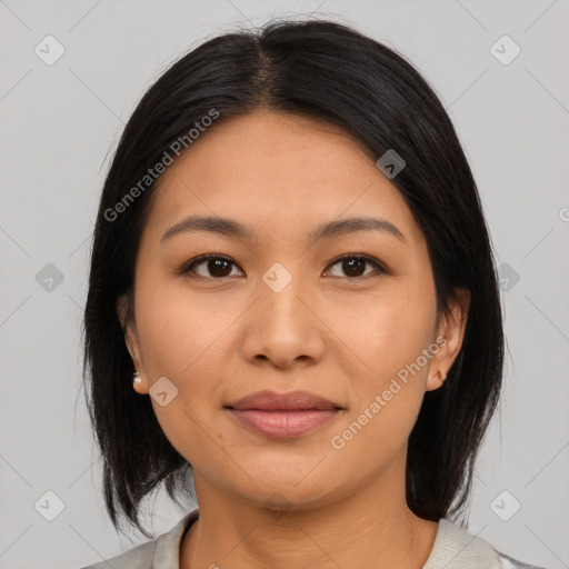 Joyful asian young-adult female with medium  black hair and brown eyes