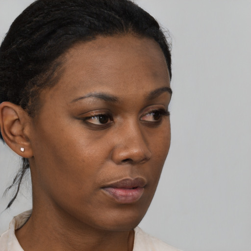 Neutral black young-adult female with short  brown hair and brown eyes
