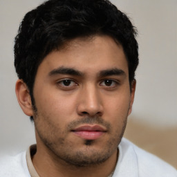 Neutral latino young-adult male with short  brown hair and brown eyes