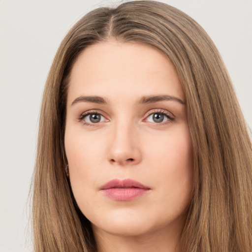 Neutral white young-adult female with long  brown hair and brown eyes