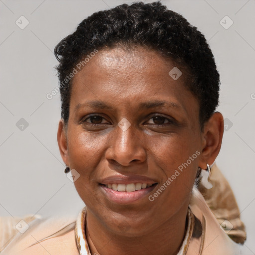 Joyful black adult female with short  brown hair and brown eyes