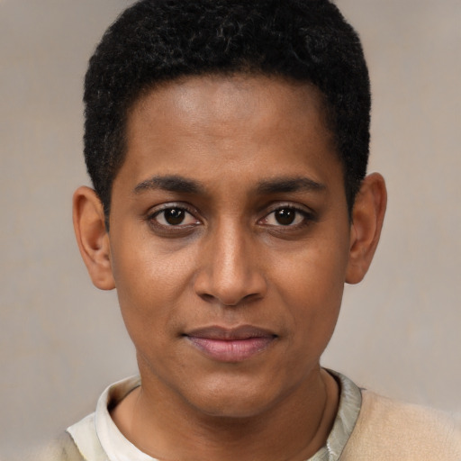 Joyful black young-adult male with short  black hair and brown eyes