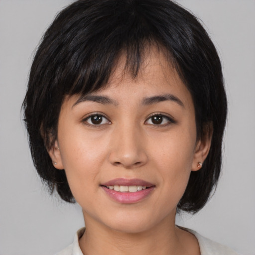 Joyful asian young-adult female with medium  brown hair and brown eyes