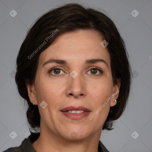 Joyful white adult female with medium  brown hair and grey eyes