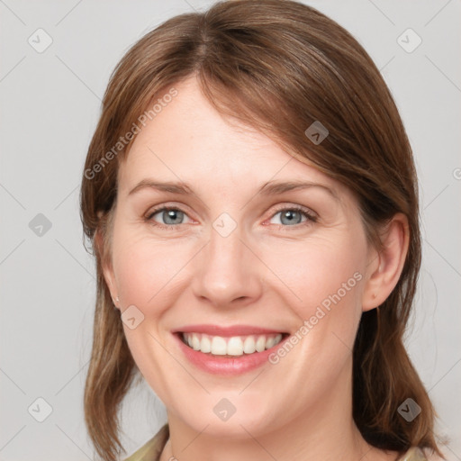 Joyful white young-adult female with medium  brown hair and blue eyes