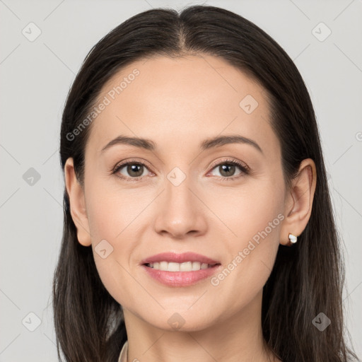 Joyful white young-adult female with long  brown hair and brown eyes