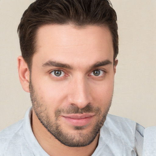 Joyful white young-adult male with short  brown hair and brown eyes