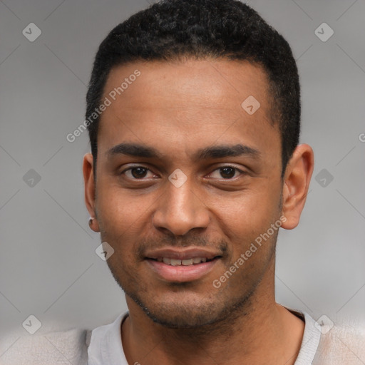 Joyful black young-adult male with short  black hair and brown eyes