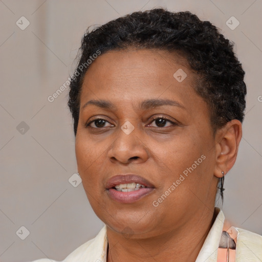 Joyful latino adult female with short  brown hair and brown eyes