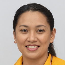 Joyful asian young-adult female with medium  brown hair and brown eyes