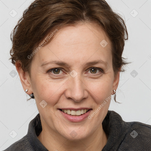 Joyful white adult female with medium  brown hair and grey eyes