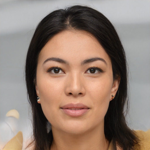 Joyful asian young-adult female with medium  brown hair and brown eyes