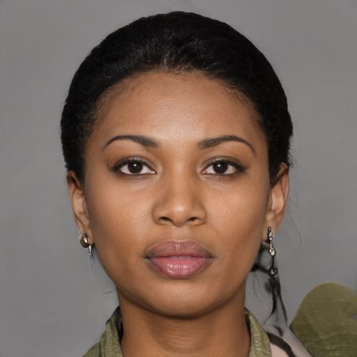 Joyful latino young-adult female with medium  black hair and brown eyes