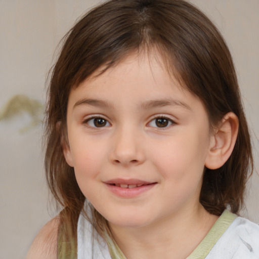 Joyful white child female with medium  brown hair and brown eyes