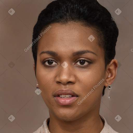 Joyful black young-adult female with short  black hair and brown eyes