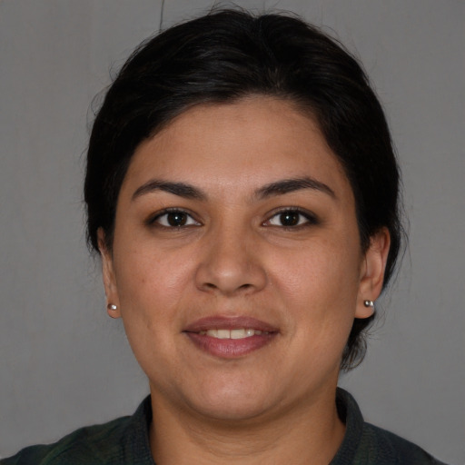 Joyful white adult female with medium  brown hair and brown eyes