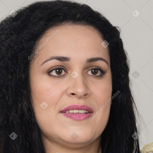 Joyful latino young-adult female with long  brown hair and brown eyes