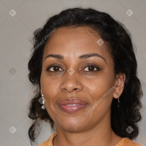 Joyful black adult female with medium  brown hair and brown eyes