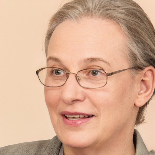 Joyful white middle-aged female with medium  brown hair and blue eyes