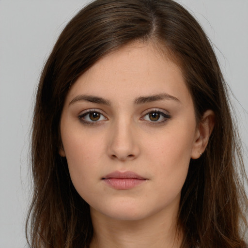 Neutral white young-adult female with long  brown hair and brown eyes