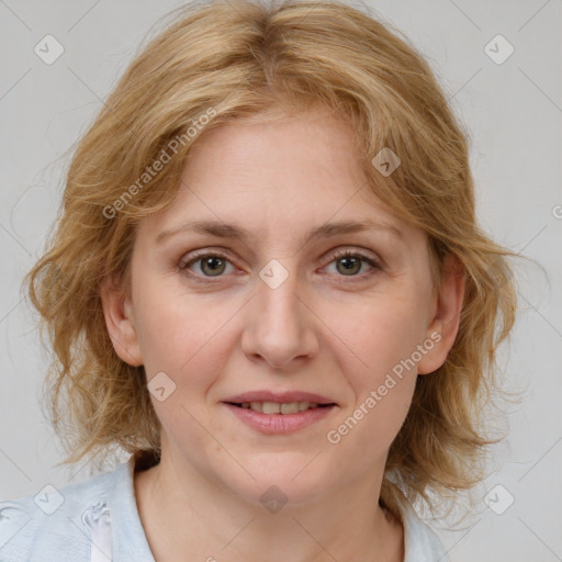 Joyful white young-adult female with medium  brown hair and blue eyes