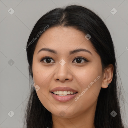 Joyful asian young-adult female with long  brown hair and brown eyes