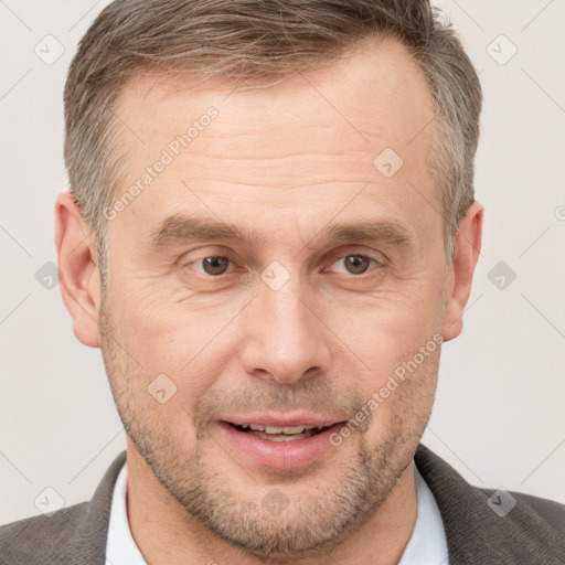 Joyful white adult male with short  brown hair and grey eyes