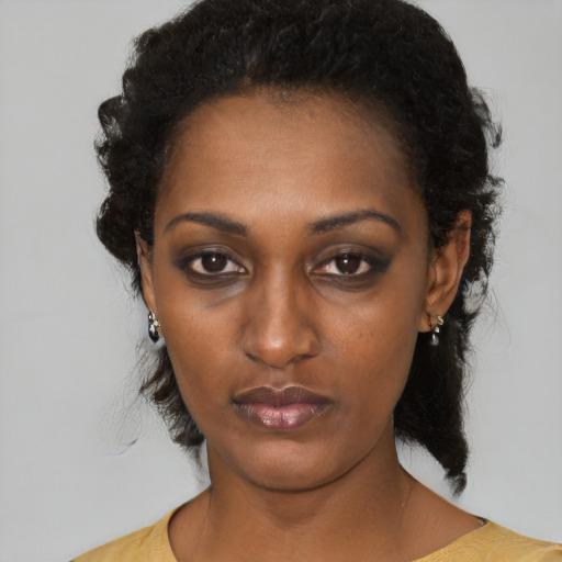 Neutral black young-adult female with medium  black hair and brown eyes