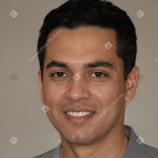Joyful white young-adult male with short  black hair and brown eyes