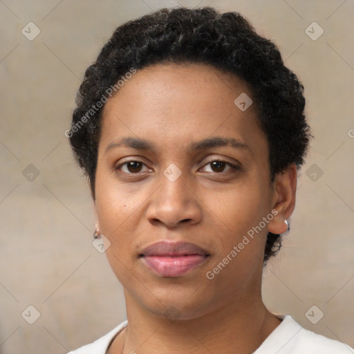 Joyful black young-adult female with short  black hair and brown eyes