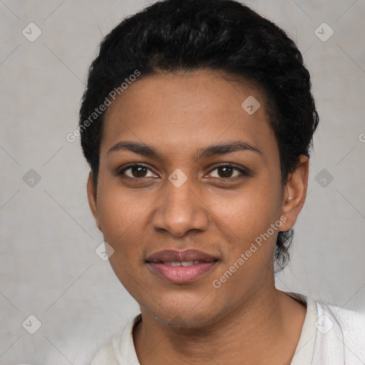 Joyful black young-adult female with short  black hair and brown eyes