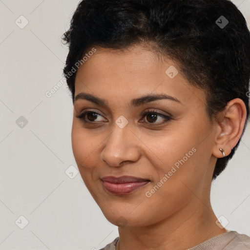 Joyful latino young-adult female with short  brown hair and brown eyes