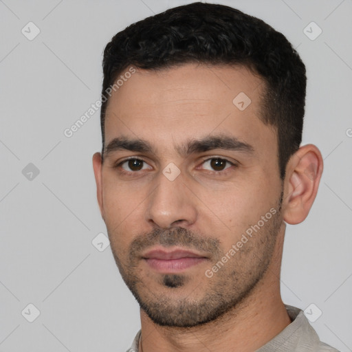 Neutral white young-adult male with short  black hair and brown eyes