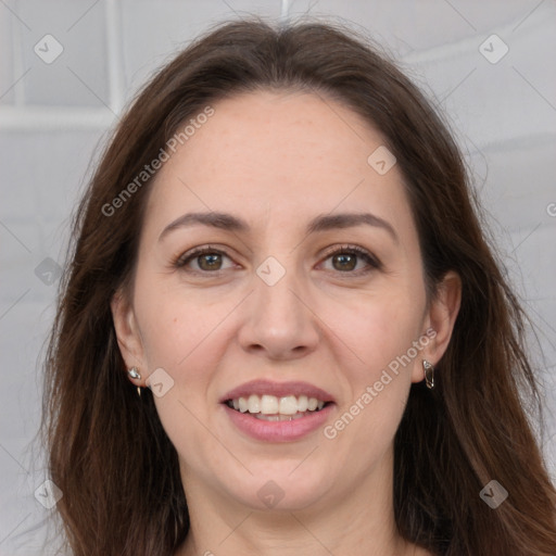 Joyful white adult female with long  brown hair and grey eyes