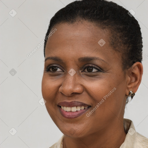 Joyful black young-adult female with short  brown hair and brown eyes