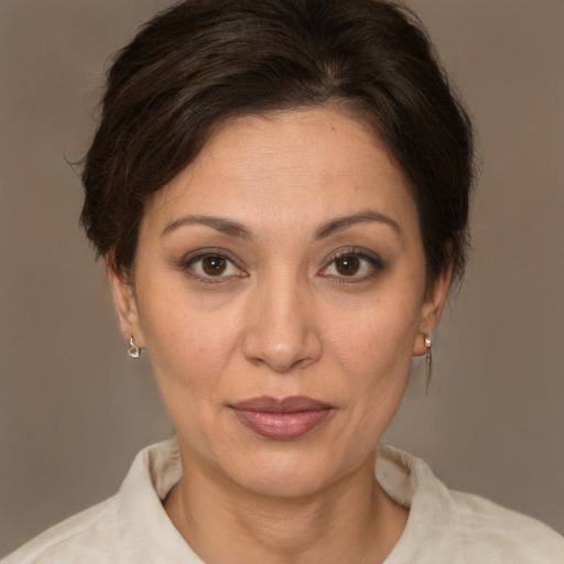 Joyful white adult female with short  brown hair and brown eyes