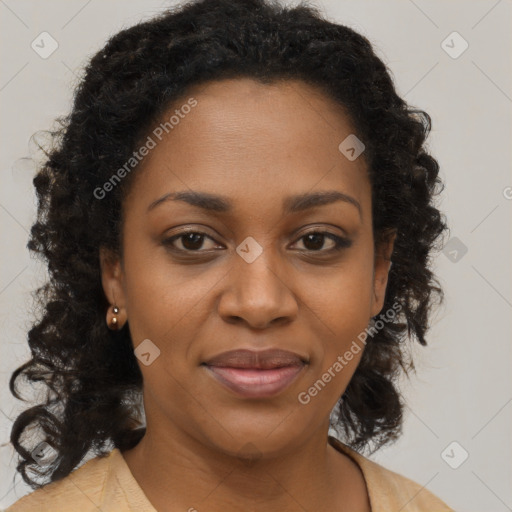 Joyful black young-adult female with long  brown hair and brown eyes