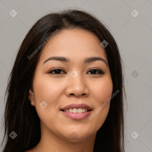 Joyful asian young-adult female with long  brown hair and brown eyes