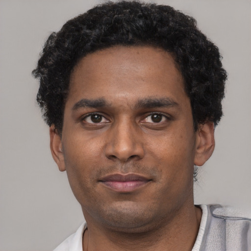 Neutral black young-adult male with short  black hair and brown eyes