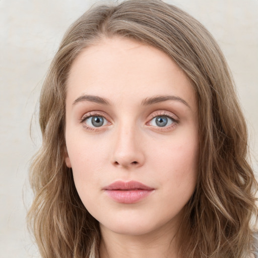 Neutral white young-adult female with long  brown hair and blue eyes