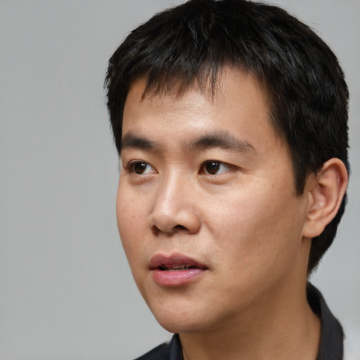 Neutral asian young-adult male with short  black hair and brown eyes
