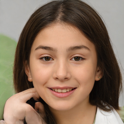 Joyful white child female with medium  brown hair and brown eyes