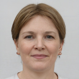 Joyful white adult female with short  brown hair and grey eyes