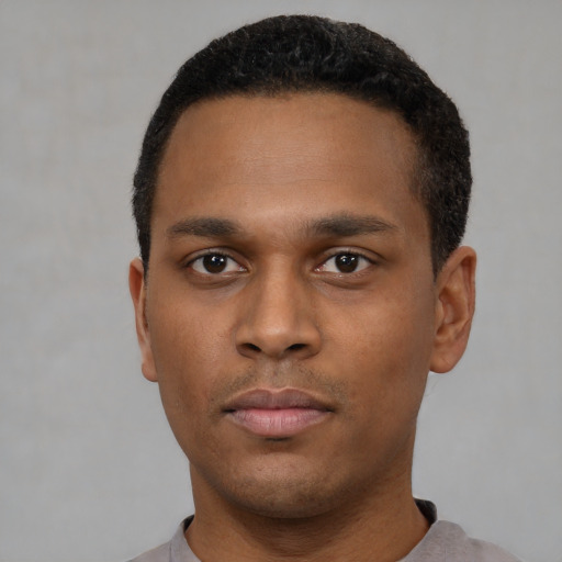 Neutral black young-adult male with short  black hair and brown eyes