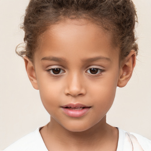 Joyful white child female with short  brown hair and brown eyes