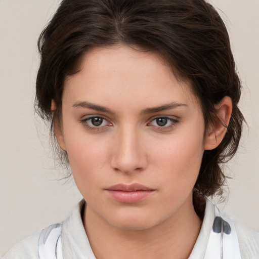 Neutral white young-adult female with medium  brown hair and brown eyes