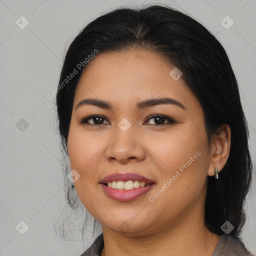 Joyful latino young-adult female with medium  brown hair and brown eyes